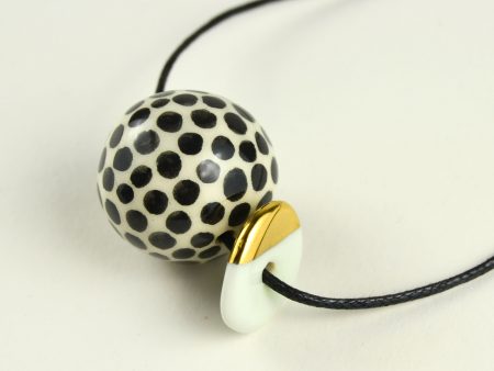 Necklace with Round Dotted Bead & Flat Bead. Decorated with Real Gold. Hand Painted with Black Polka Dots. Sliding Knots. Made by Gruni.