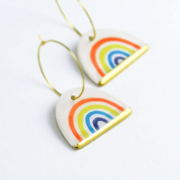 Rainbow Hoop Earrings. 3 x 4.5 cm (1.18 x 1.77 in). 7 g (0.2469 oz). Colorful rainbow drawing. Ceramics decorated with gold. Handmade by Gruni.