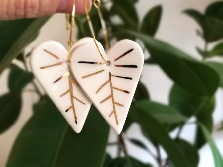 White Leaf Hoop Earrings. Ceramics decorated with real gold. Creative jewelry. 3.2 x 7.5 cm (1.25 x 2.95). 8 g (0.28 oz). Made by Gruni.