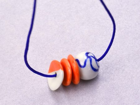 Asymmetrical Orange & Blue Porcelain Beads. 2 x 2 x 7 cm (0.78 x 0.78 x 2.75 in), Necklace: 42 cm (16.53 in). Handmade by Gruni