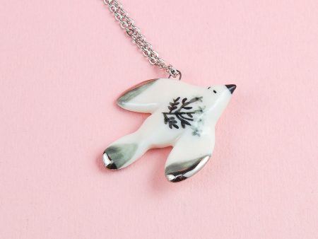 Porcelain Flying Bird Pendant, decorated with platinum. Charm size: 2 x 2.5 cm (0.78 x 0.98 in). Handmade by Gruni.