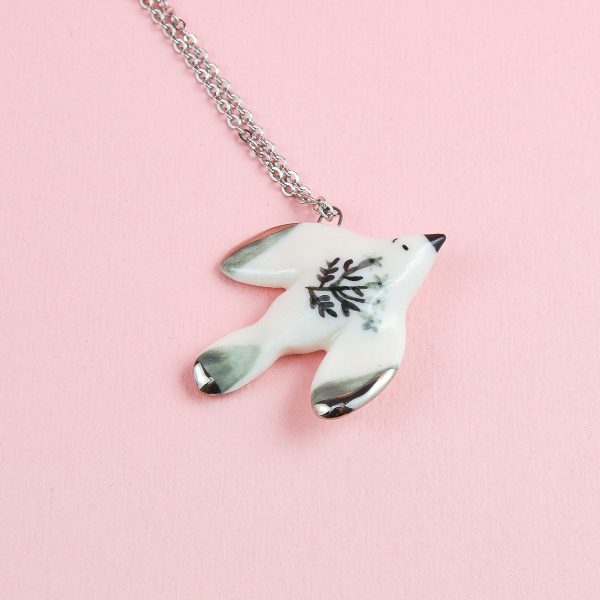 Porcelain Flying Bird Pendant, decorated with platinum. Charm size: 2 x 2.5 cm (0.78 x 0.98 in). Handmade by Gruni.